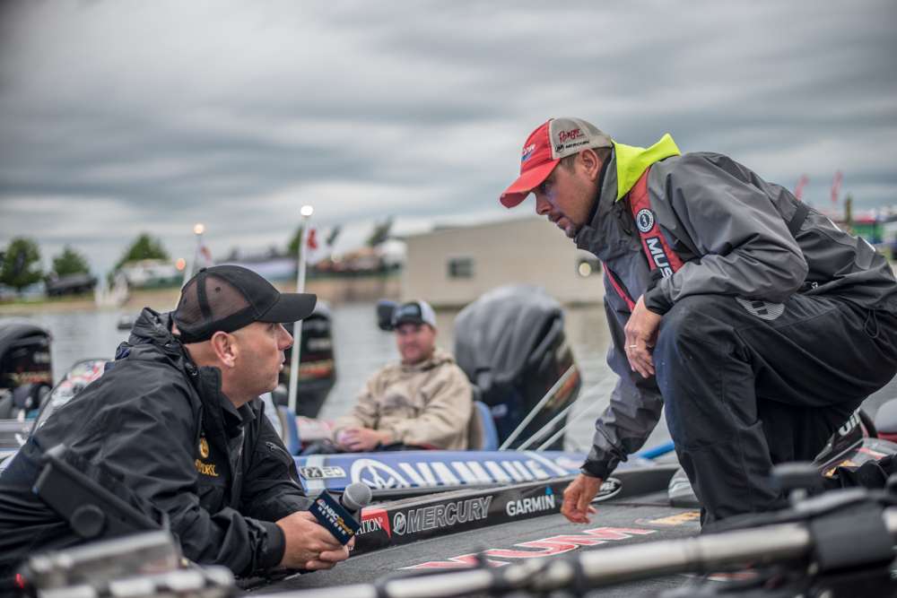 Over at the takeoff area emcee Dave Mercer talks to Jason Christie about his day two plans on Lake Fork. 