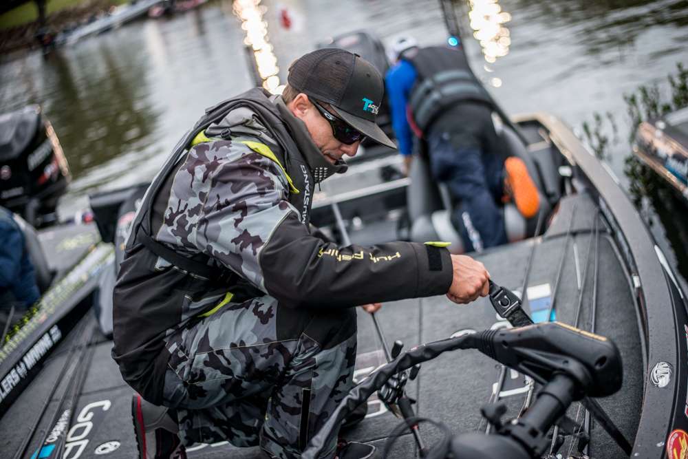 Brent Ehrler straps down his rods after rigging his baits. 