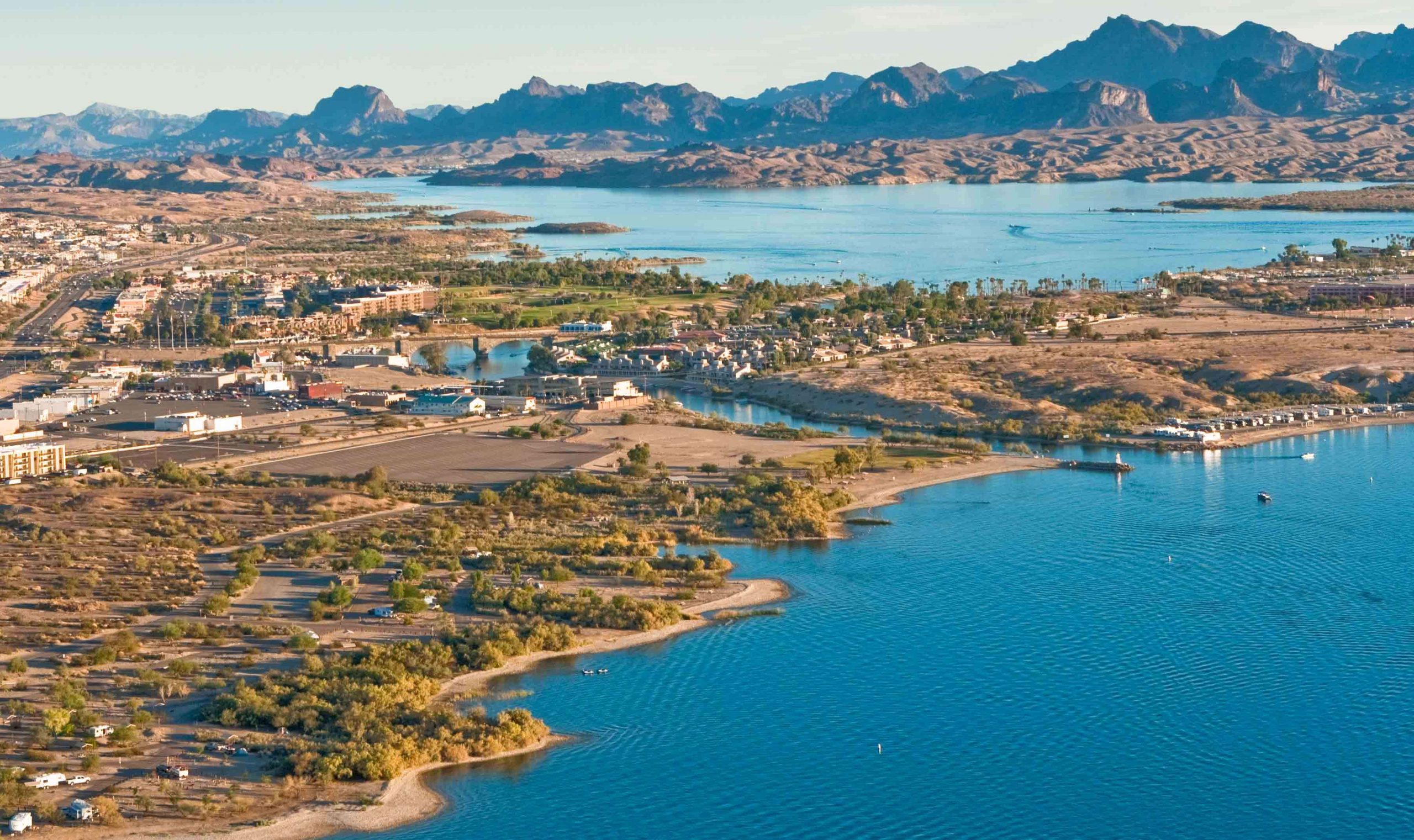 Lake Havasu is a large reservoir on the Colorado River, and it is located on the California and Arizona border. The lake sits behind Parker Dam, and the lake's primary purpose is storing water for pumping the dam's two aqueducts.