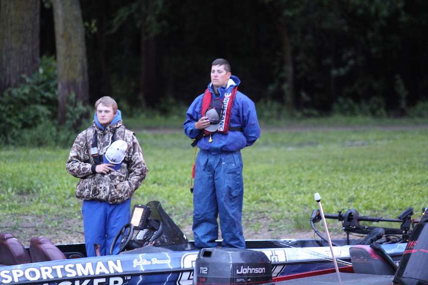 Anglers pay their respects as the anthem plays prior to launch. 