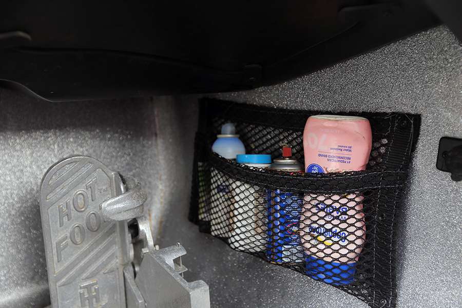 A small storage pouch near his Hot Foot throttle control holds several important items, including his sunscreen. 