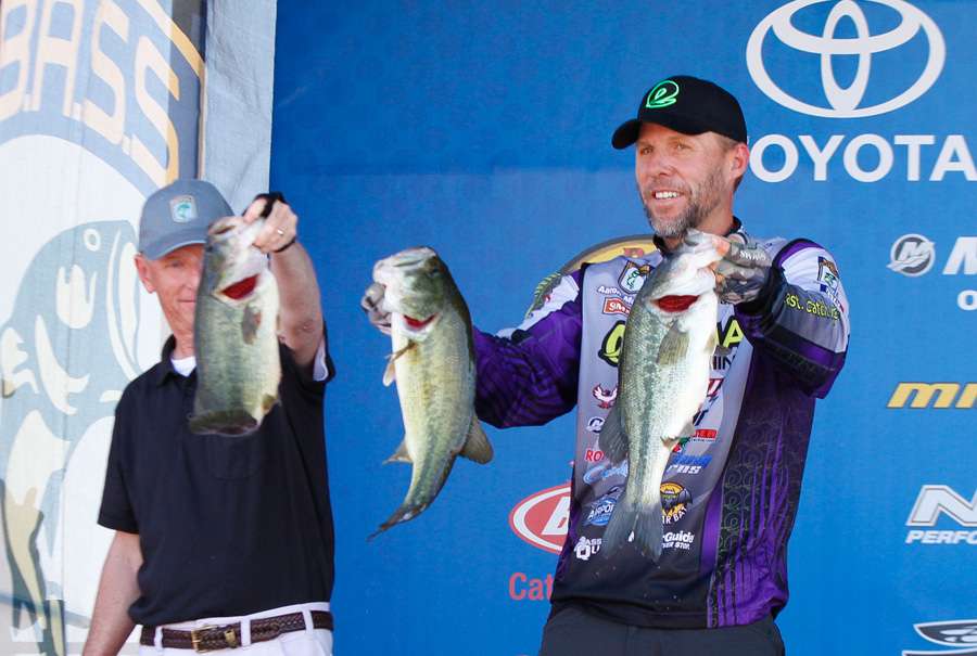 With assistance from Trip Weldon, Martens shows off some of his 19-5 bag of fish that propelled him into the lead with a total of 68-9.