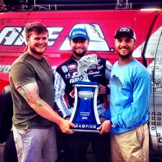 The Lucas brothers, (from left) Joe, Justin and Kevin, pose with Justinâs trophy at the Sacramento Bassmaster Elite. 