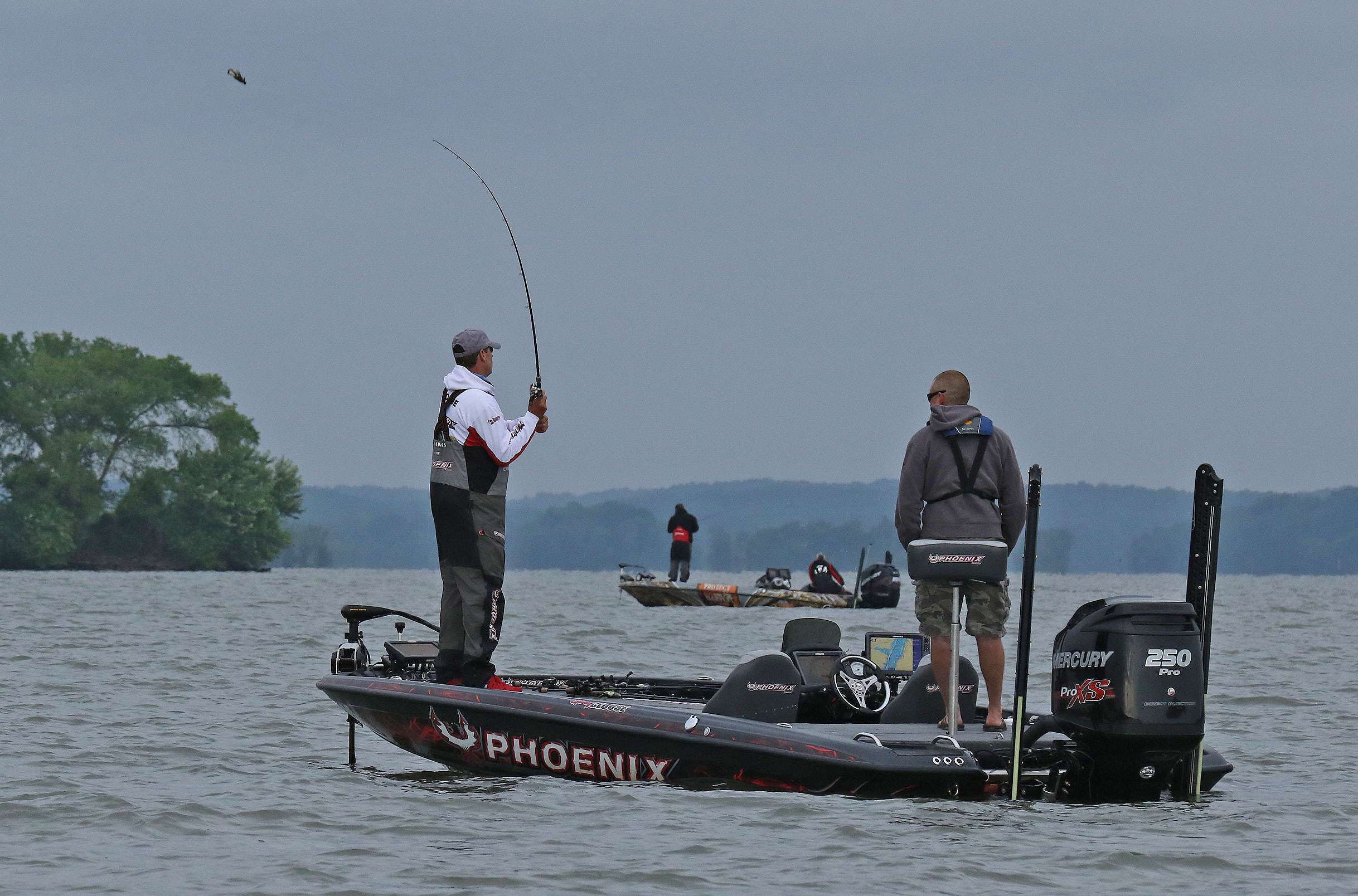 Gary Clouse makes a cast early on Day 1 of the Zippo BASSfest at Kentucky Lake presented by A.R.E. Truck Caps. That's John Murray in the background. The two shared an area in the upper portion of the lake.