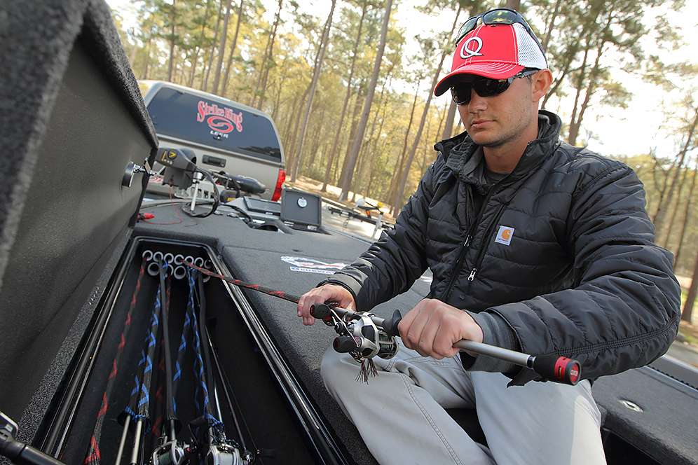 His rod and reel selection includes EXO and Smoke models from Quantum. He uses rod socks to protect the guides on the rods and to make them easy to slide in and out of the locker.