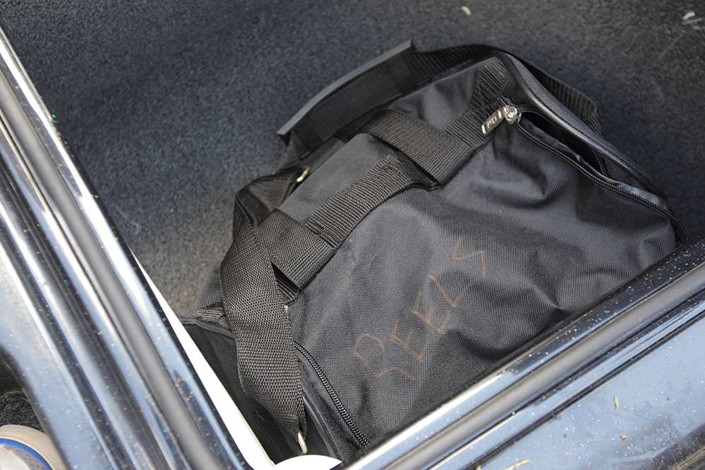 In a small box in front of the driverâs seat, Lee keeps a duffel bag with extra reels for emergency situations.
