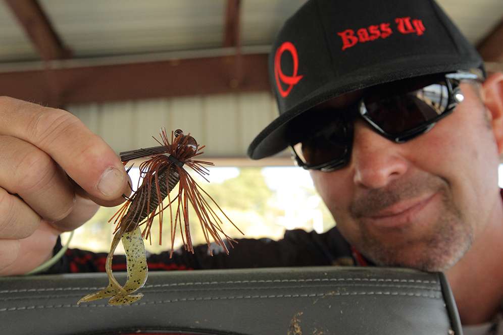 A 3/8-ounce brown round-weight jig made by War Eagle. The trailer is a Zoom green pumpkin Twin-Tail. 