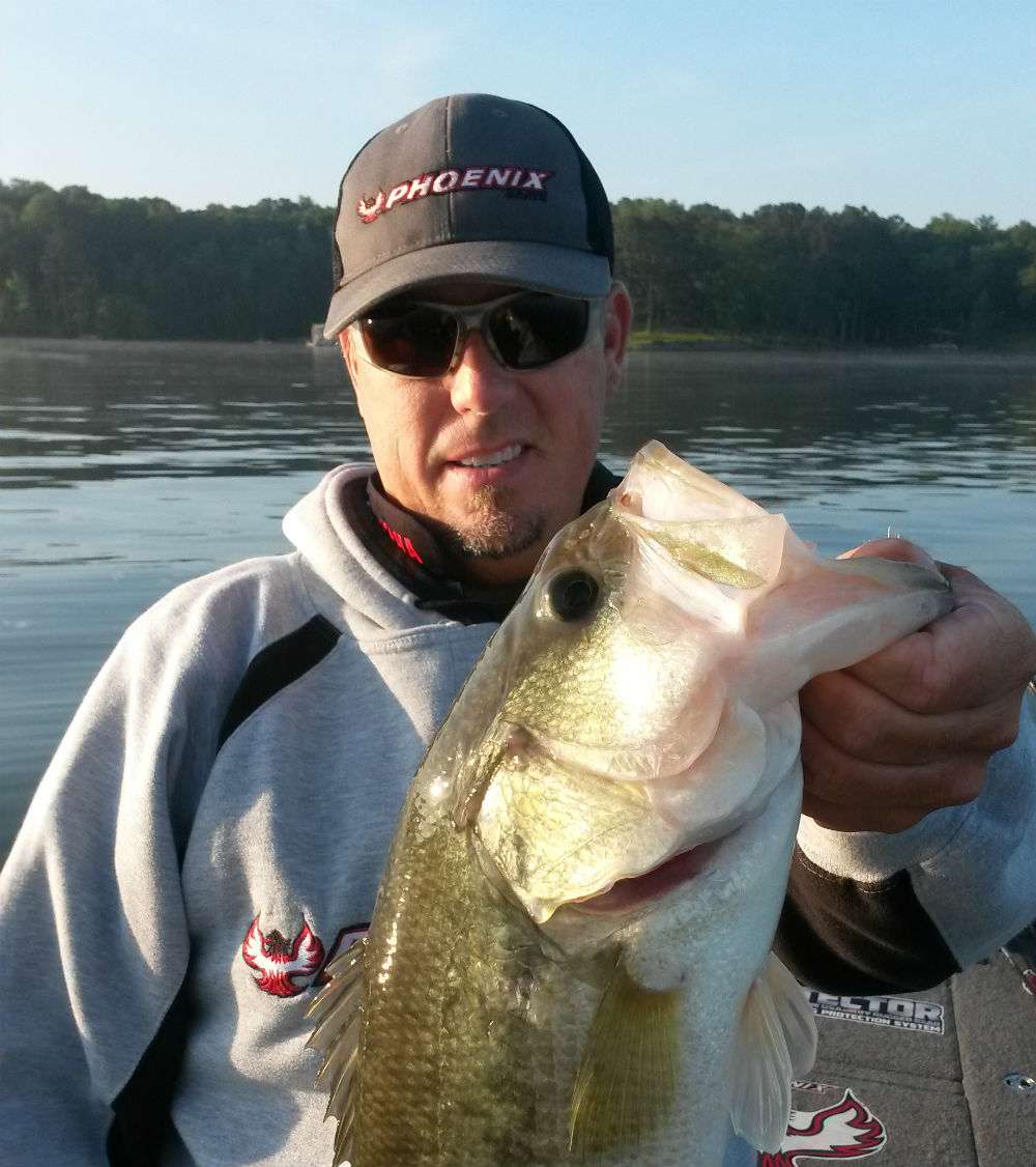 Russ Lane with his first keeper of the day. Photo by Bassmaster Marshal Brian Carroll