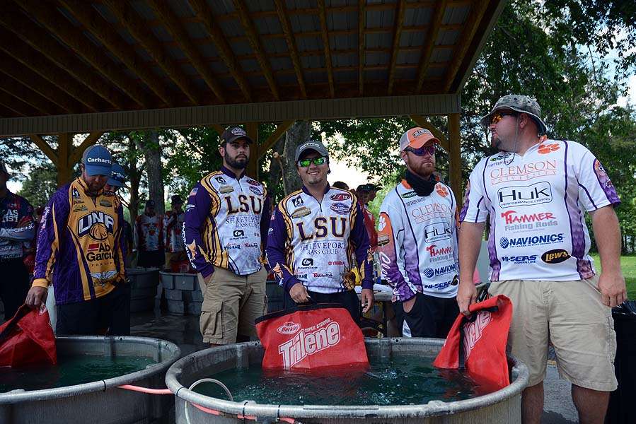 The second flight teams gather at the weigh-in tanks. 