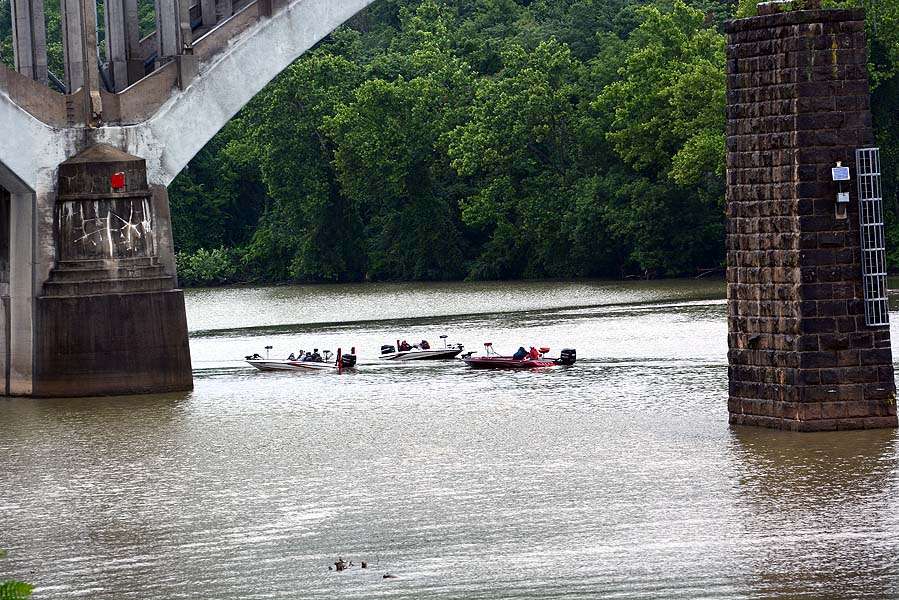 The boats gather at the launch ramp beneath the bridge crossing the river into downtown Fairmont. 