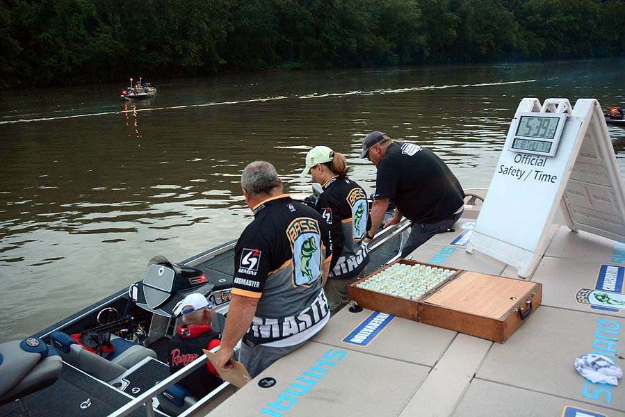 The B.A.S.S. staff checks another boat for safety gear just minutes before takeoff. 