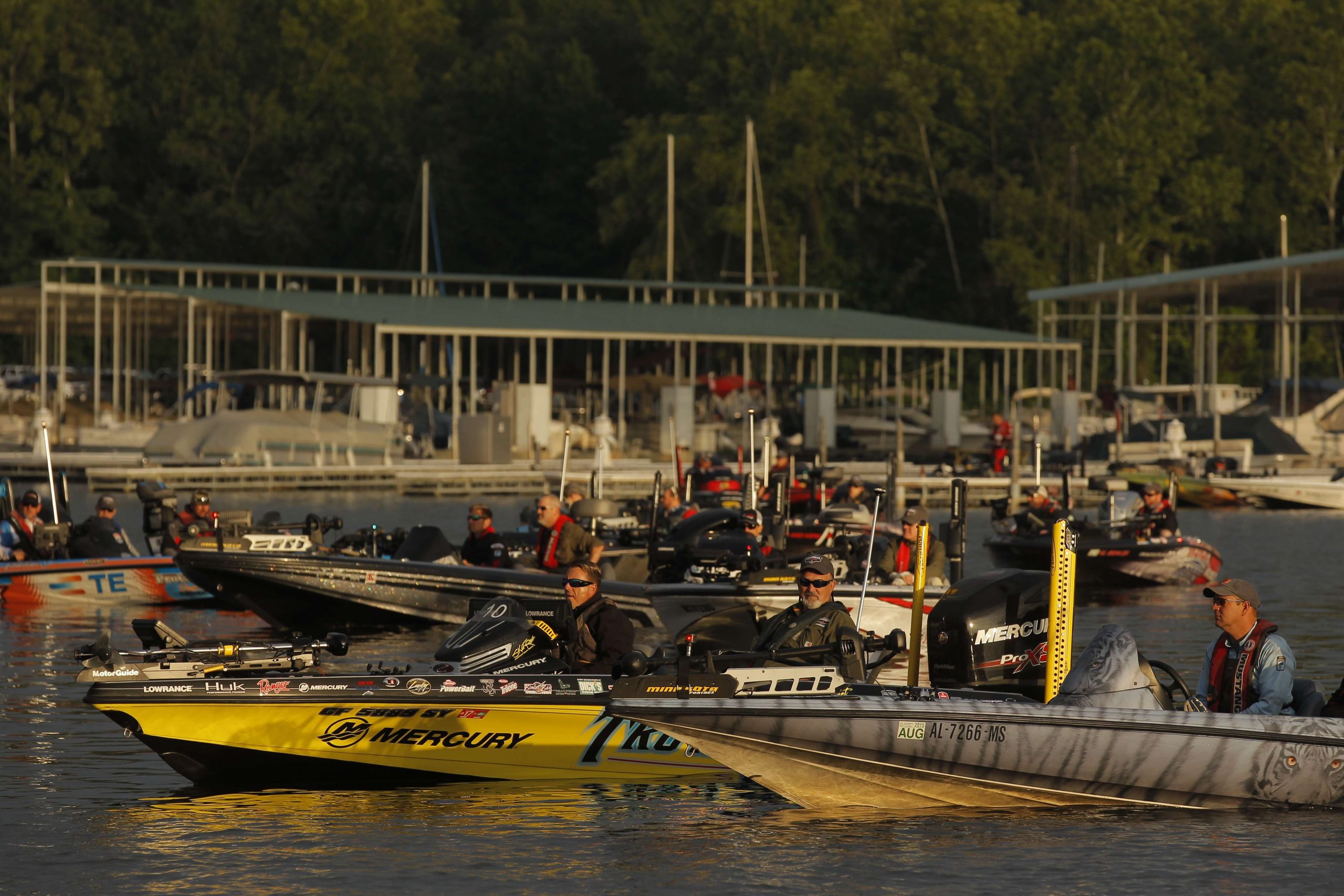The boats slowly float in and get organized for launch.