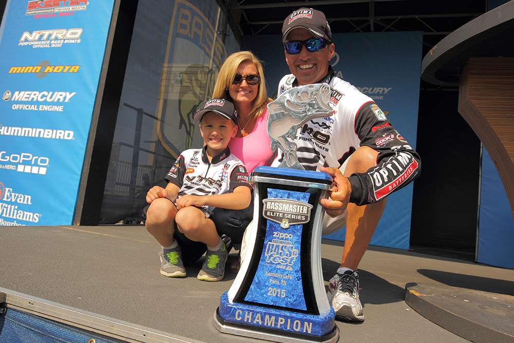 Evers, his wife, Tuesday, and son, Kade, pose with the trophy. Daughter Kylee was at church camp.
