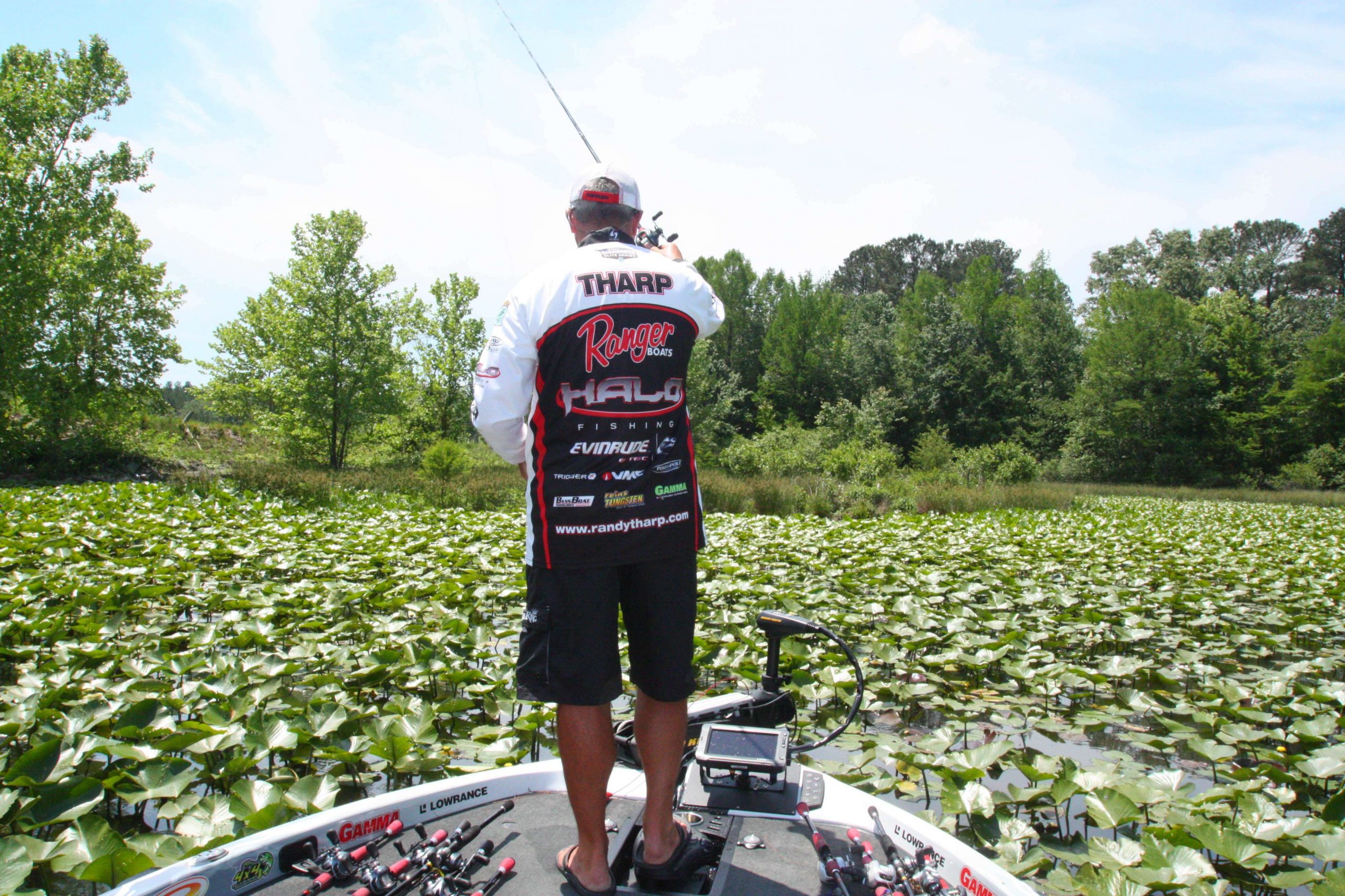Tharp caught his biggest bass of the day while using a punch craw in thick pad cover.