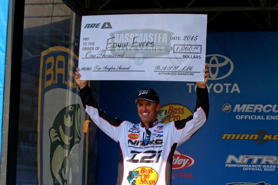 It was a big day for big checks and Edwin Evers. He cashed on contingency checks, the first from A.R.E. Truck Caps.