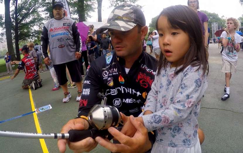 Matt Lee, along with fellow Elite Mike Iaconelli, helped teach kids how to cast with one of the 400 Zebco reels donated for the parkâs lending program.