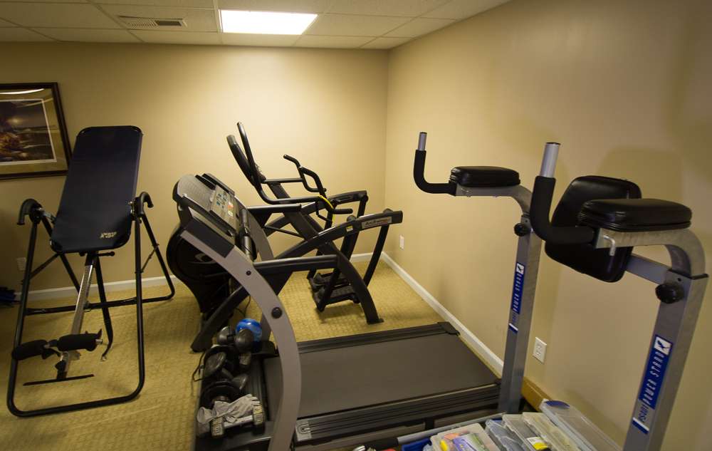 This room was originally an exercise room, but Randy took it over. He says he wishes he could take the inversion table with him everywhere. It helps his back after a long day on the water. 