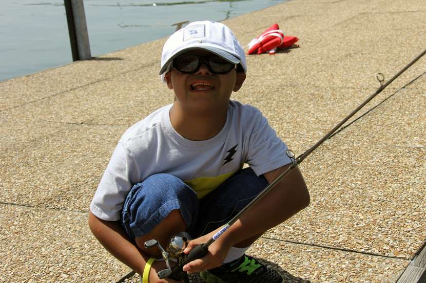 This little guy was all smiles at the fishing station.
