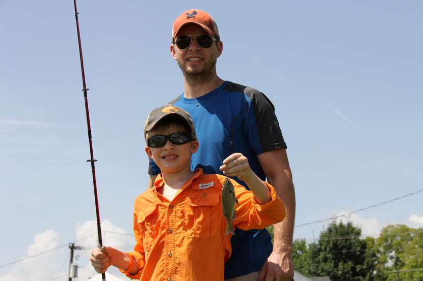 A young angler and his proud dad.
