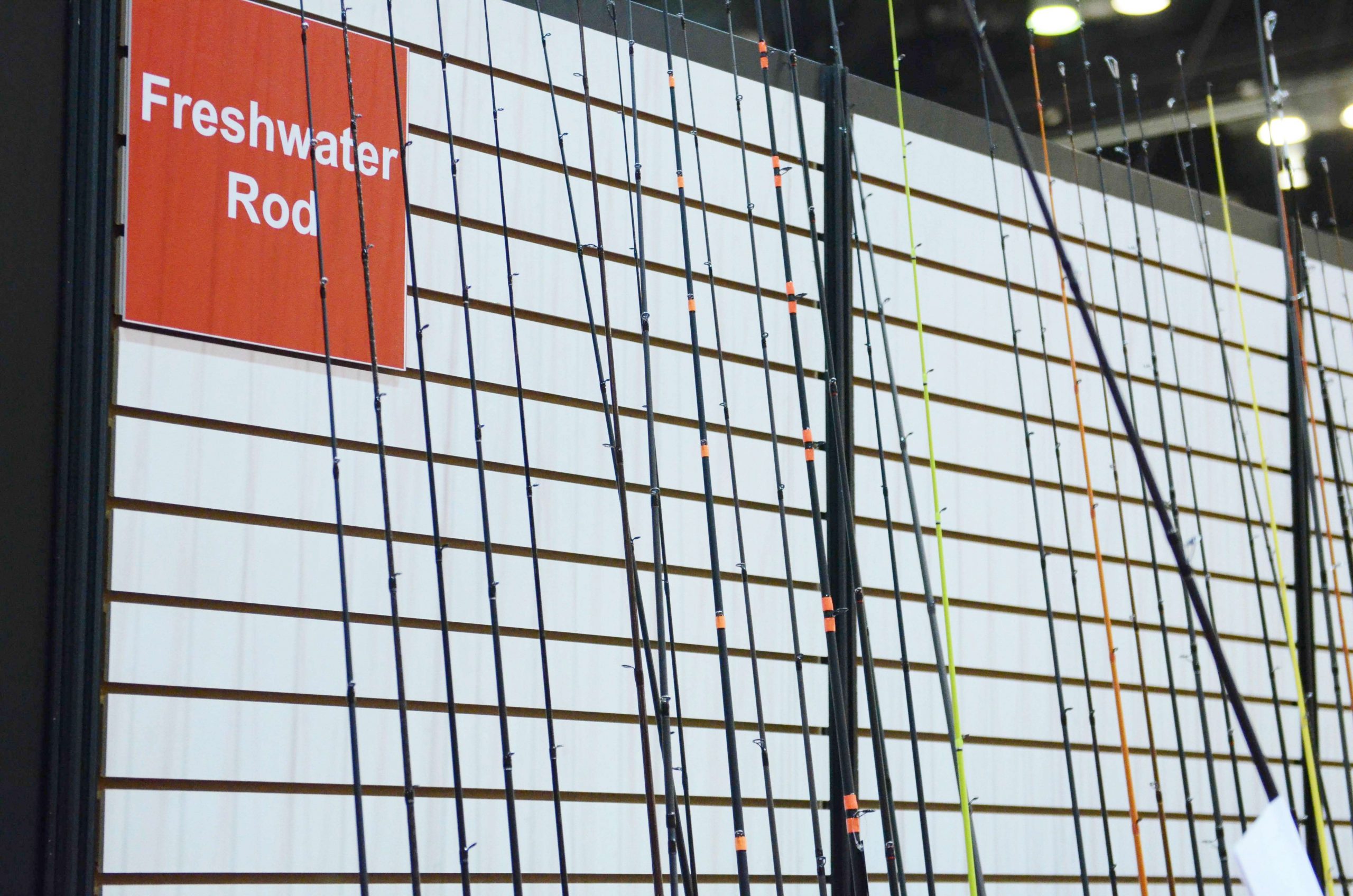 The New Product Showcase includes a long rack of freshwater rods and reels.