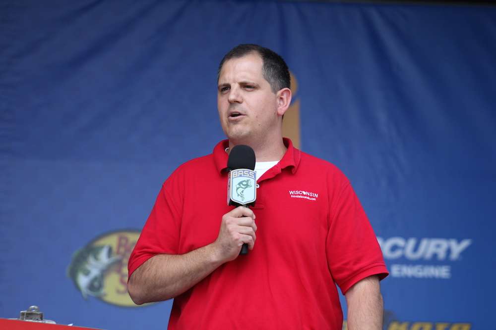 Jeff Anderson with the Wisconsin Department of Tourism welcomes the crowd as the Day 2 weigh-in gets underway for the Carhartt Bassmaster College Series National Championship presented by Bass Pro Shops on Lake DuBay. 