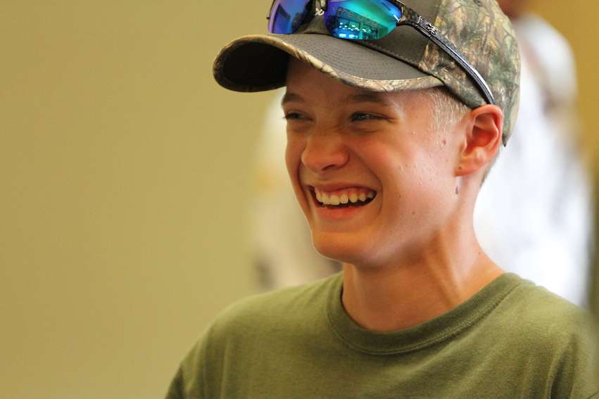 Anglers laugh and enjoy the registration.