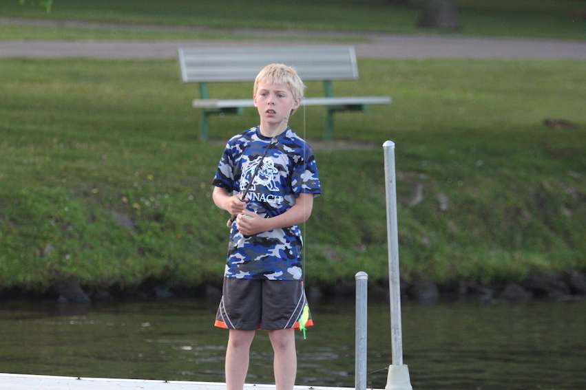 The only angler left at the dock is a future college angler, up early fishing on a Sunday morning.
