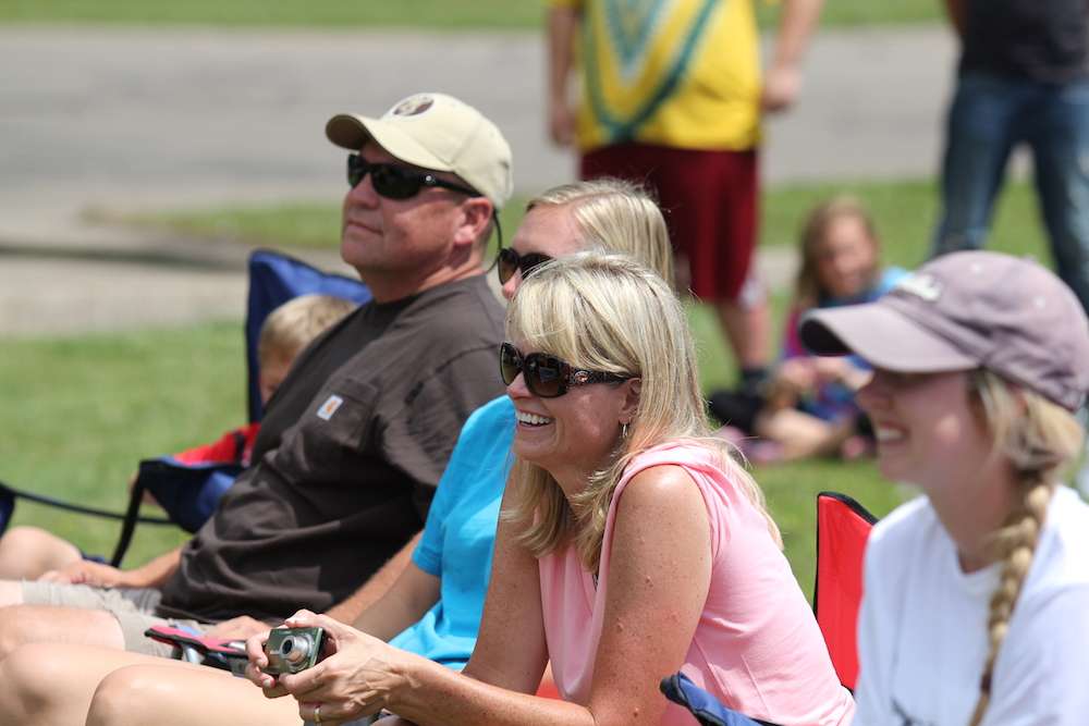 The Whitaker family looks on.
