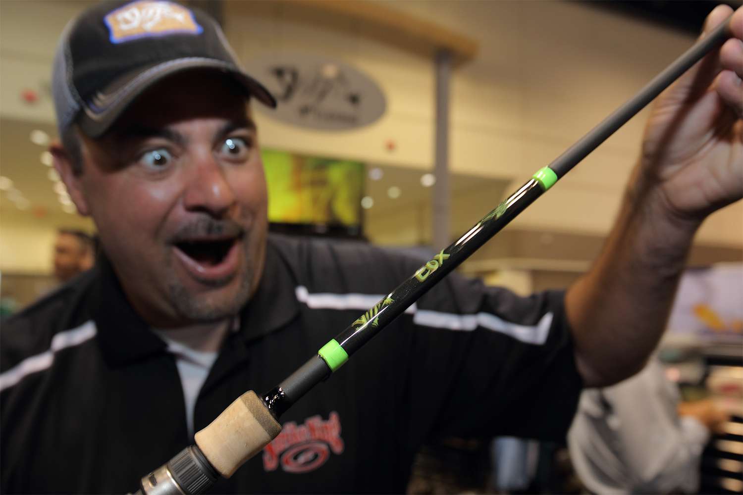 Mark Zona is like a kid in a candy store at ICAST. Karen, hint, hint. G. Loomis E6X under the tree.