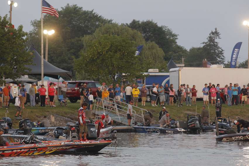 Fans gather on the shore to watch their favorite anglers takeoff.