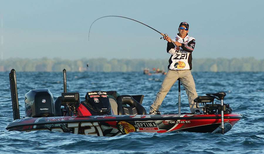 Edwin Evers anchors himself to the front of his boat as he makes long casts into St. Clair.