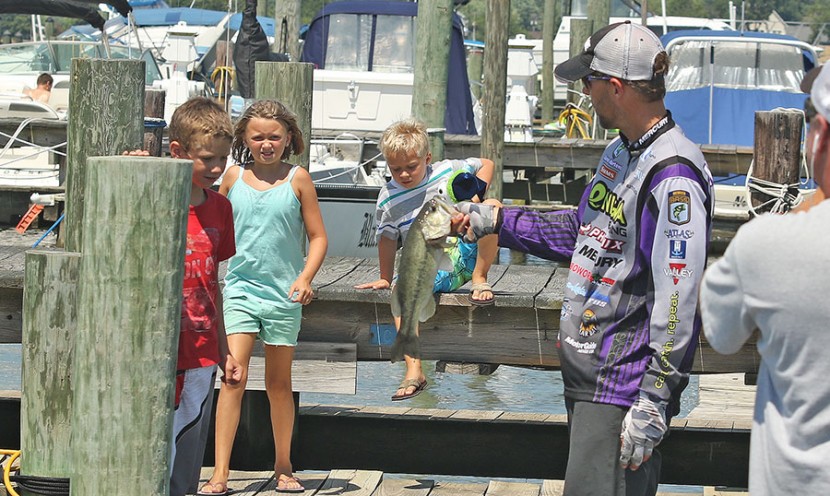 His excitement forced a group of kids on the dock to come running and Martens was all too happy to show them his final catch of the day.