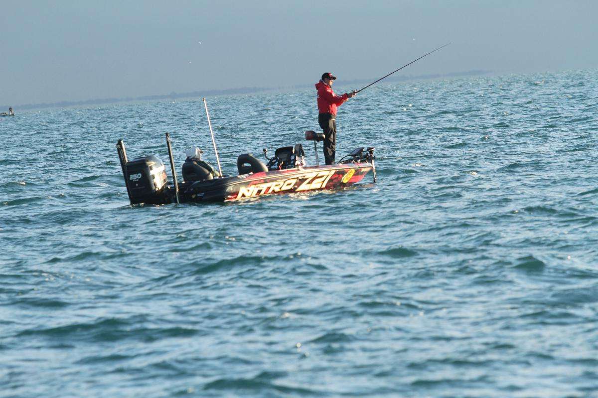 While keeping his boat and bait moving to cover water effectively, he continues to look for the next active fish.