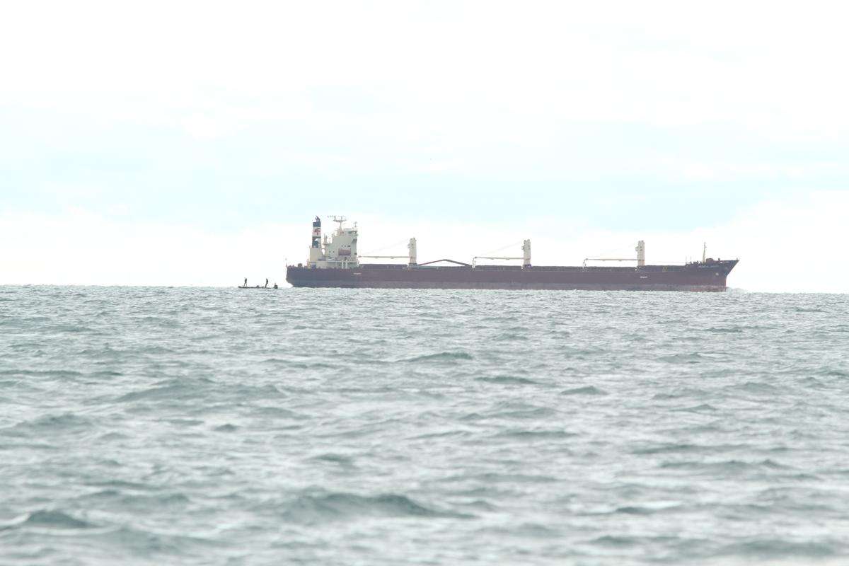 Another giant freighter is moving along the river channel towards the center of St. Clair.