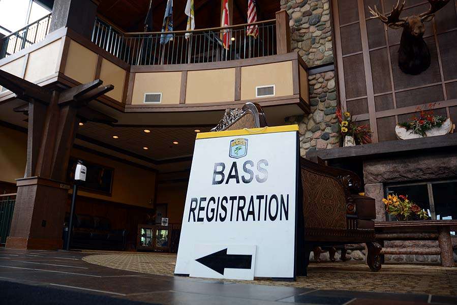 The sign directs the way upstairs to the registration inside the resort.