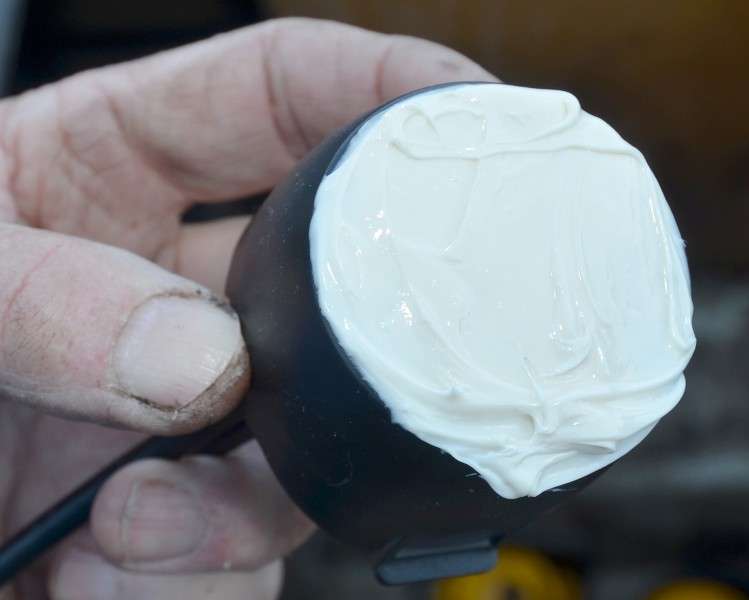 Coat the bottom of the transducer with the rest of the epoxy to ensure it will get a good grip.