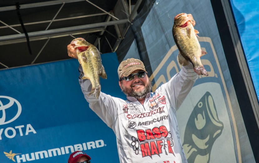 Greg Hackney brings his fish to the scales. He finished 3rd with 72-11.