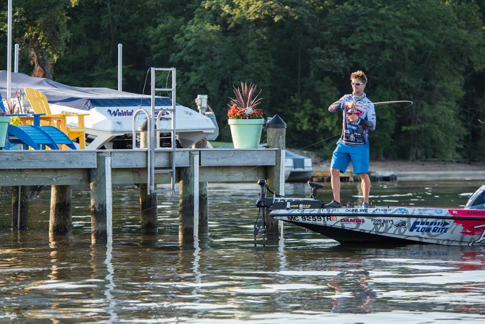 Chad brings the fish away from the dock supports. 