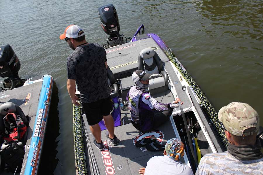 Aaron Martens has a crowd as he gets prepared to bag his fish.