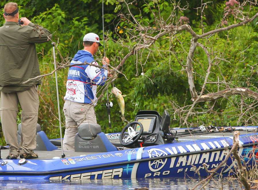 â¦before pulling the fish into his boatâ¦