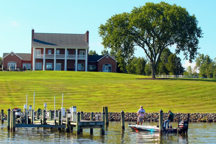 He stops to fish near one of the beautiful homes on Chesapeake Bay. 