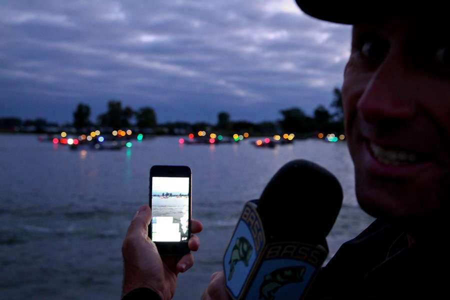 Emcee Dave Mercer was multi-tasking, both announcing the anglers names and shooting BassCams. 