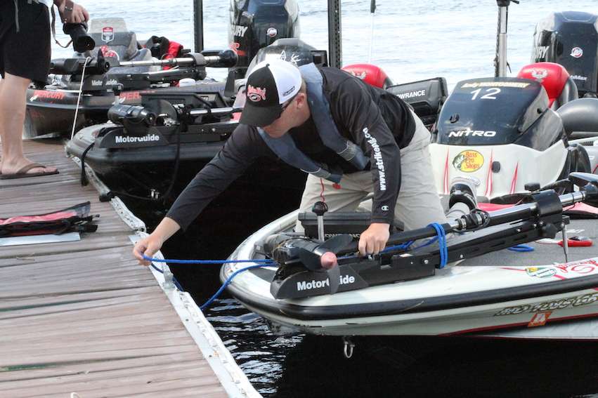 Andy Montgomery ties up to the dock to get a bag for his fish.