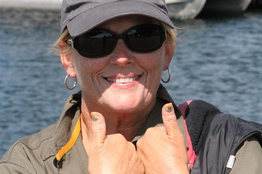 A Bassmaster Marshal shows off her bass inspired finger nails.