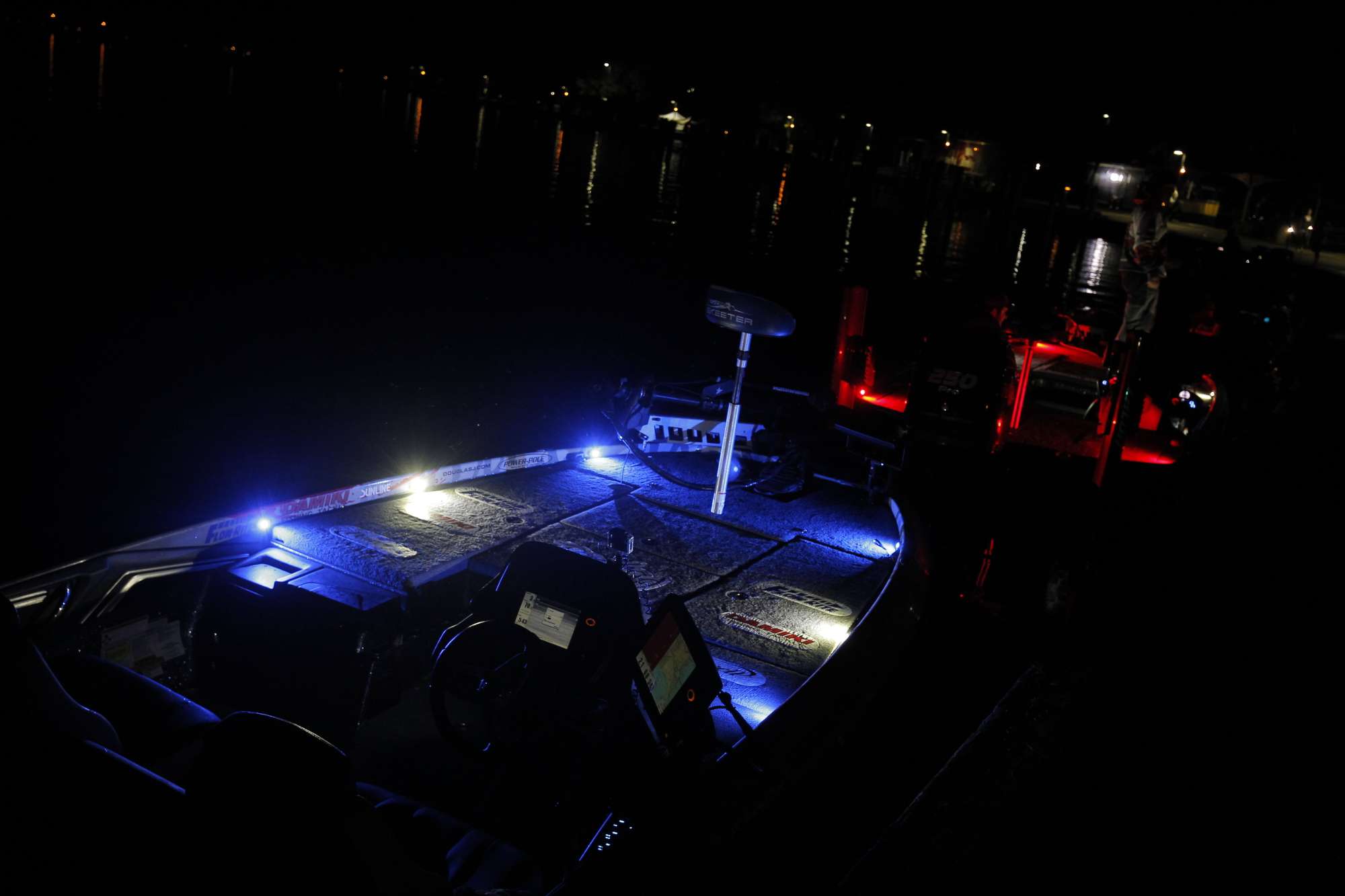 The darkness at the final-day launch at Lake St. Clair Metropark was broken only by the lights on the boats.