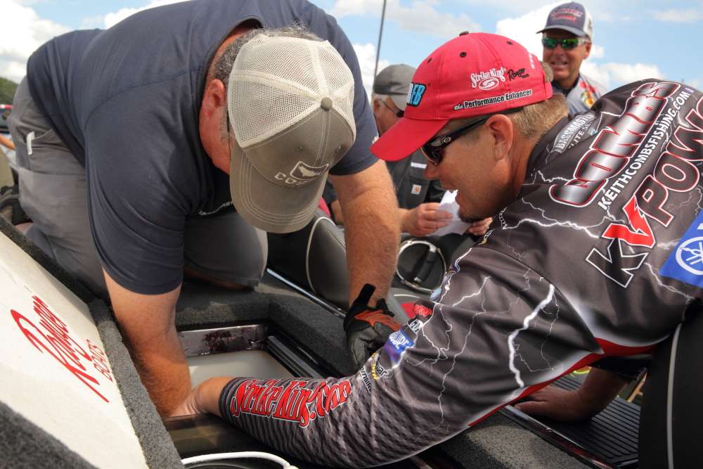 Keith Combs is next to get his fish checked by B.A.S.S. officials as the anglers make their way to the weigh-in stage.