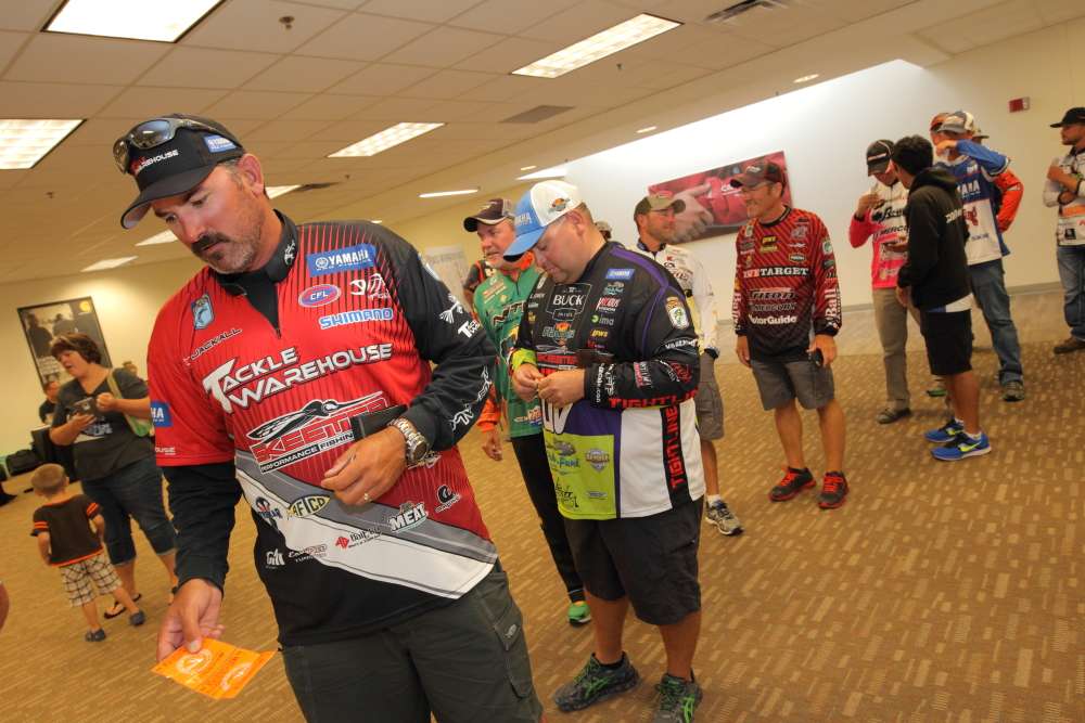 Jared Lintner and other anglers wait in line for registration.