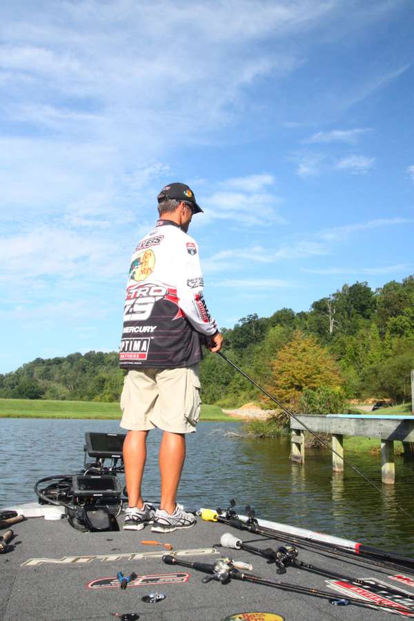 9:03 a.m. Still hunting his first keeper bass, Evers runs a bladed jig around a boat dock on Lake H.    