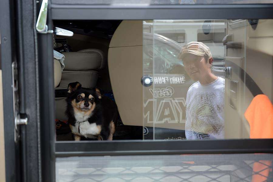 This scene is typical of many in Americaâs suburban neighborhoods. The family dog greets his master when arriving home from work. Meet Adam, one of two Chihuahuas that are part of the Fukae family. 