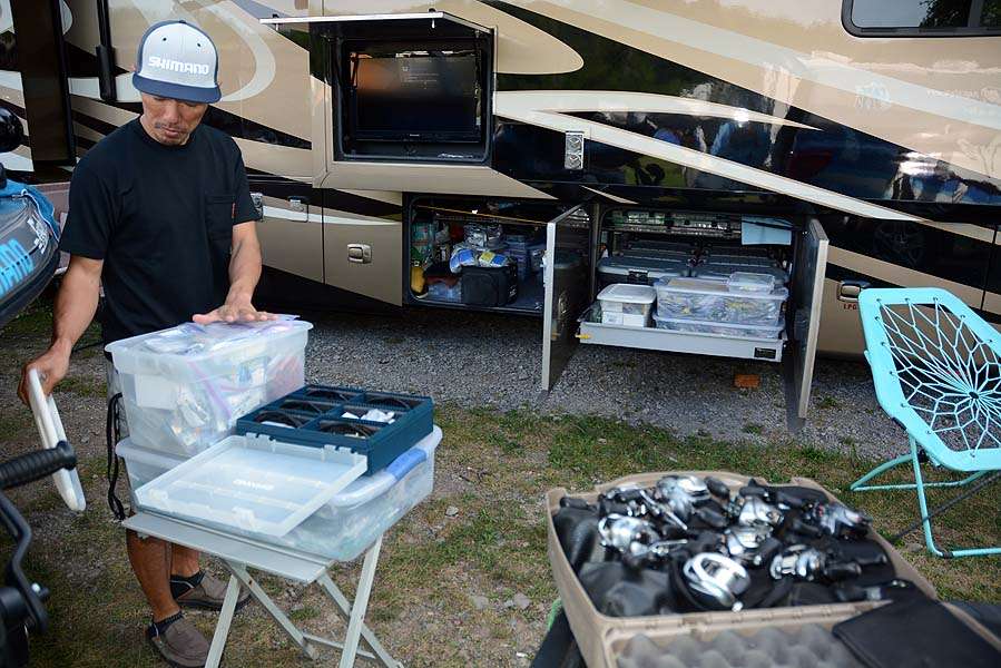 The satellite TV is tuned to a music channel while Shin prepares tackle for the next tournament. The âbasementâ of the RV is a mini man cave of tackle for virtually any fishing scenario. 